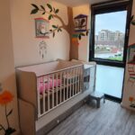 Vrolijke babykamer muurschildering in Eindhoven
